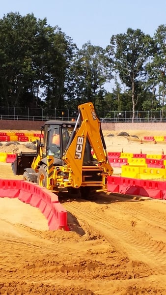 kids drive backhoe at Diggerland USA