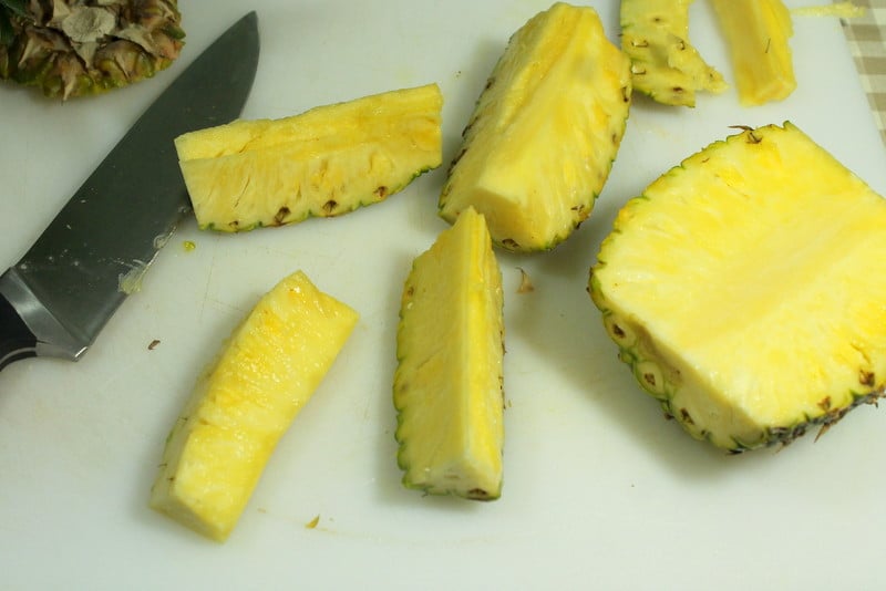 How to cut pineapple easily - cut each quarter in half -