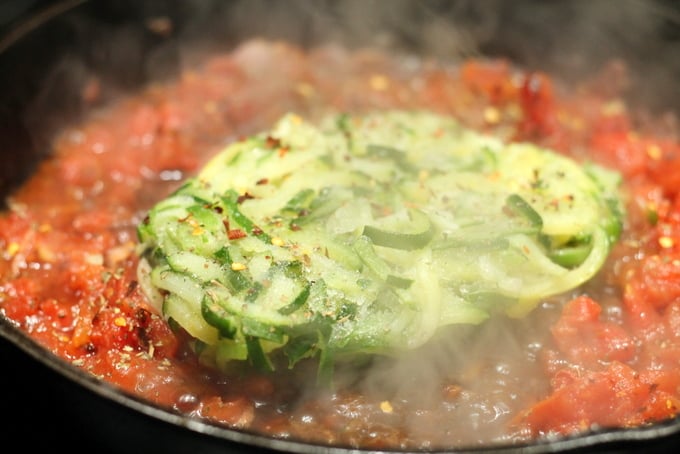 Zucchini Noodles Cooking in Tomato Bacon Sauce